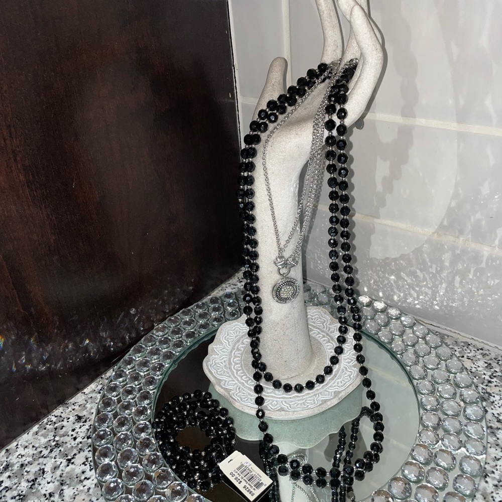 Long black beaded necklace and single bracelets with silver circle necklace